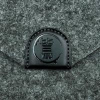 Mina dual felt scissor case button closure detail