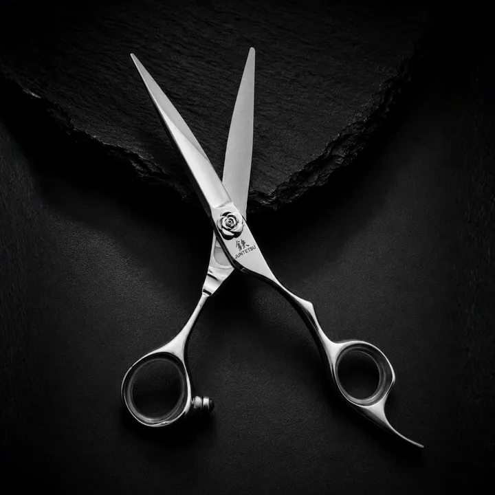 Juntetsu Rose cutting scissors with blades open on black slate