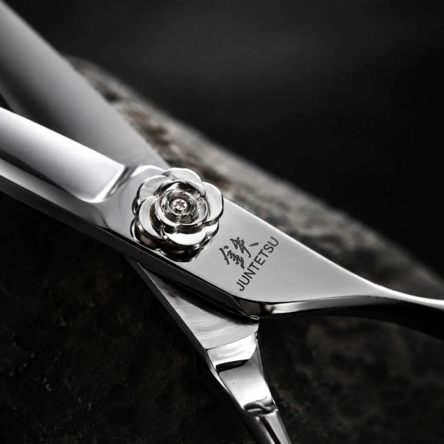 Close-up of the rose-shaped pivot screw on a Juntetsu Rose scissor