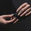 Professional hands holding cutting scissors in studio