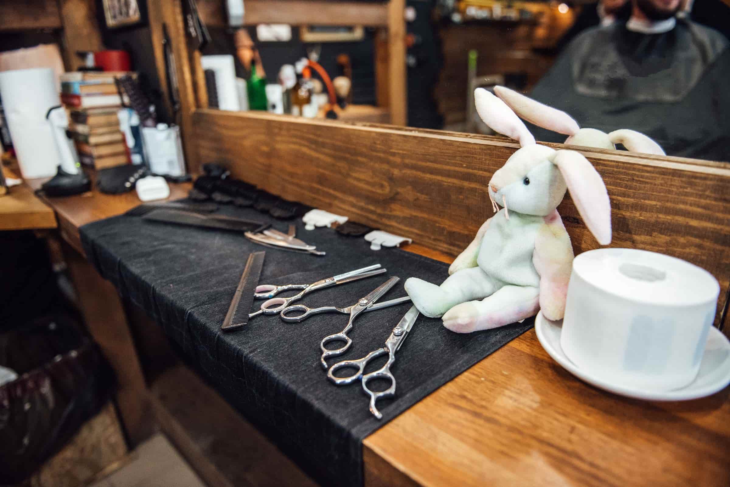 Barber setting up clean shears and combs before opening the shop
