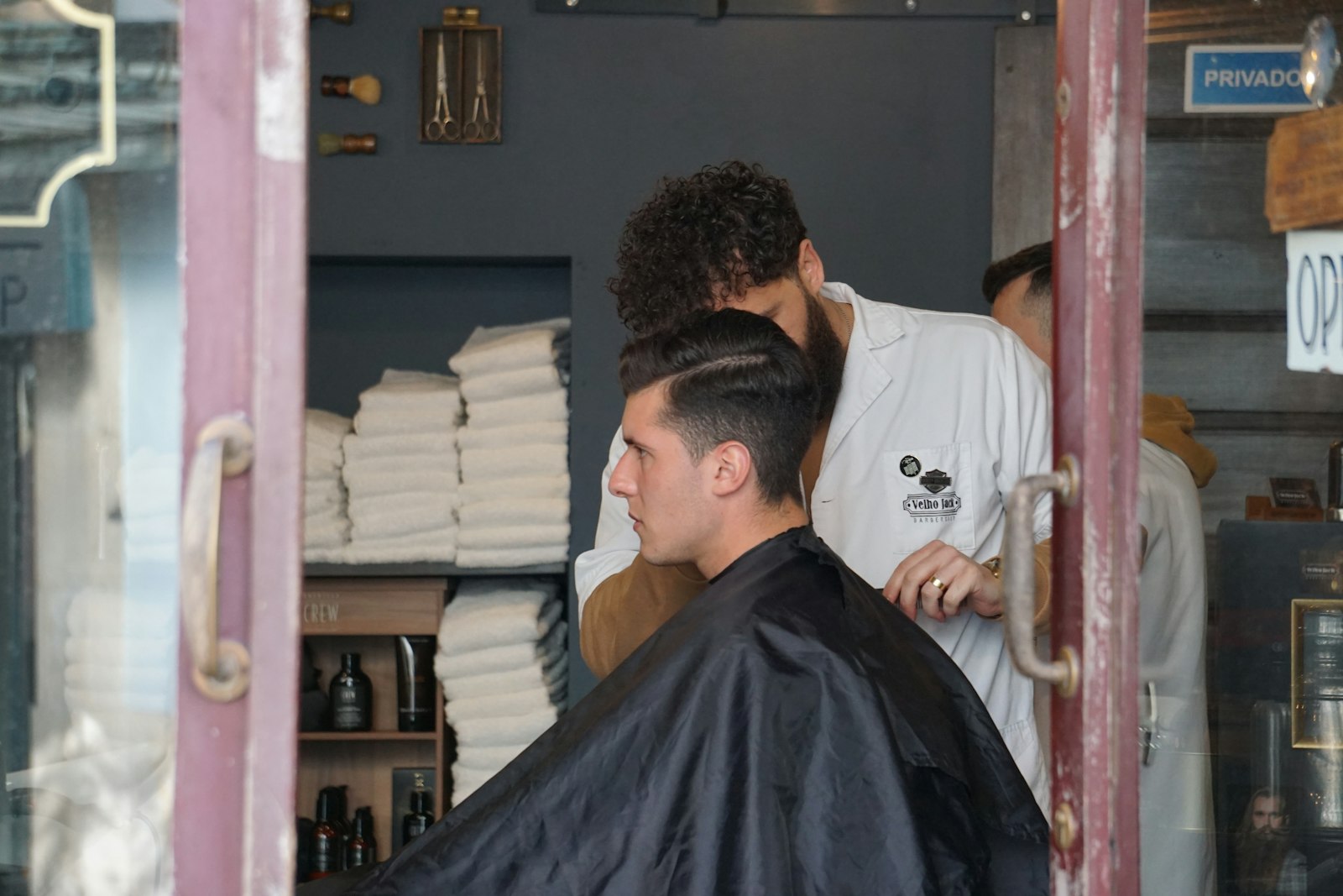 Barber reviewing finances in the shop